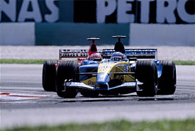 Fernando Alonso, Renault; and Rubens Barrichello, Ferrari