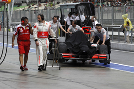 McLaren retrieves Jenson Button's spun car in Malaysian GP qualifying 2010