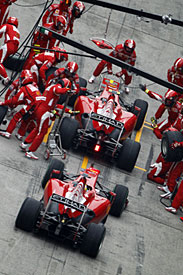 Fernando Alonso moves to the front of the pit queue