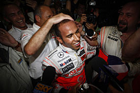 Lewis Hamilton celebrates his title in 2008