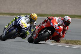 Casey Stoner races with Valentino Rossi in Germany