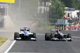 Michael Schumacher squeezes Rubens Barrichello in Hungary