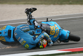 Loris Capirossi crashes at the first corner at Misano