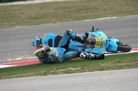 Loris Capirossi crashes at the first corner at Misano