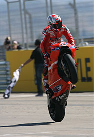Casey Stoner celebrates at Aragon