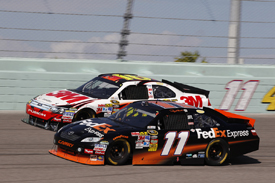 Denny Hamlin races with Greg Biffle at Homestead