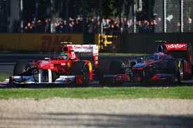 Felipe Massa races against Jenson Button in Melbourne
