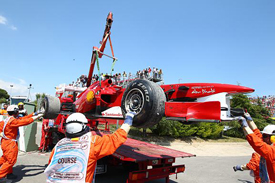 Felipe Massa's retired Ferrari is retrieved at Catalunya