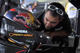 Juan Pablo Montoya talks to Kimi Raikkonen at Charlotte
