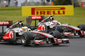 Lewis Hamilton races with Jenson Button in Hungary