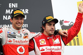Fernando Alonso and Jenson Button on the Hungarian GP podium