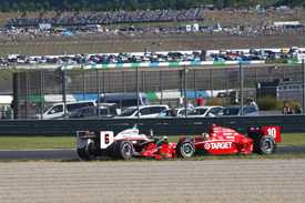 Dario Franchitti collides with Ryan Briscoe at Motegi