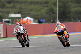 Casey Stoner beats Ben Spies over the line