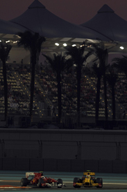 Vitaly Petrov leads Fernando Alonso in Abu Dhabi in 2010