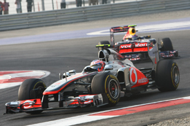Jenson Button, McLaren, leads Mark Webber, Red Bull, 2011 Indian Grand Prix