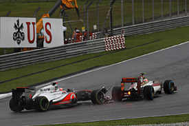 Button takes blame for Karthikeyan clash