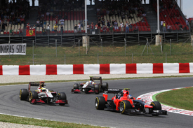 Charles Pic's Marussia leads Pedro de la Rosa and Narain Karthikeyan's HRTs in Spain 