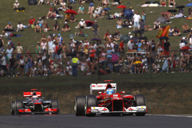 Fernando Alonso leads Jenson Button in Hungary