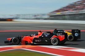 Timo Glock races Heikki Kovalainen at Austin