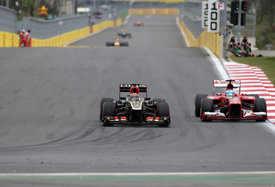 Kimi Raikkonen, Lotus, passes Fernando Alonso, Ferrari, Korean GP 2013