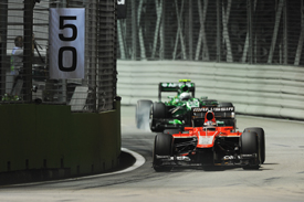 Jules Bianchi, Marussia, leads Giedo van der Garde, Caterham, Singapore GP 2013