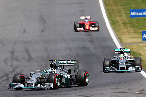Rosberg holds off Hamilton for win