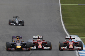 Sebastian Vettel, Red Bull, Kimi Raikkonen and Fernando Alonso, Ferrari, battle in the 2014 German GP, Hockenheim