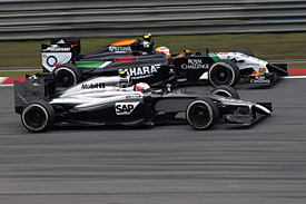 Kevin Magnussen, McLaren, races Sergio Perez, Force India, Chinese GP 2014, Shanghai