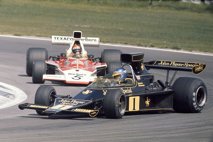 Emerson Fittipaldi (pictured behind the sideways Ronnie Peterson) wins his second world championship