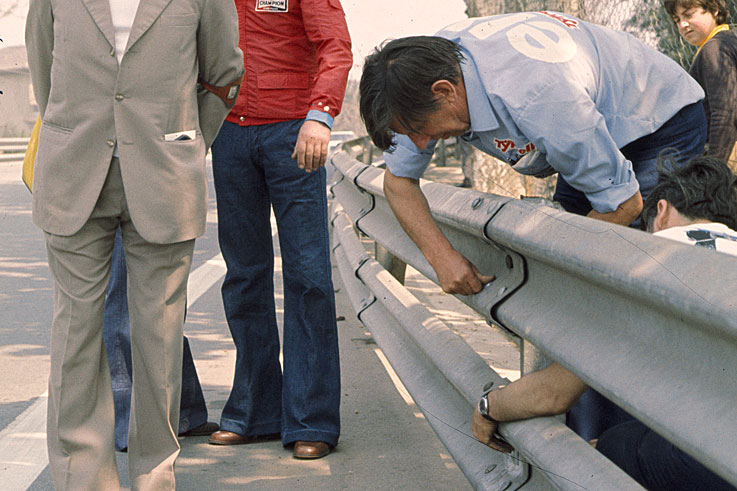 Ken Tyrrell inspecting the Montjuich Park barriers that caused drivers to refuse to go out on track